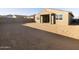 Spacious backyard featuring neutral groundcover and a covered patio area at 20319 N 224Th Dr, Surprise, AZ 85387