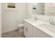 Well-lit bathroom with double sink vanity, modern fixtures, and tiled floor at 20319 N 224Th Dr, Surprise, AZ 85387
