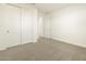 Neutral bedroom featuring large closet and doorway to another room at 20319 N 224Th Dr, Surprise, AZ 85387