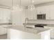 Bright kitchen with white cabinets, granite countertops, and stainless steel appliances at 20319 N 224Th Dr, Surprise, AZ 85387