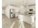 Spacious open kitchen with a large island, stainless steel appliances, and modern finishes at 20319 N 224Th Dr, Surprise, AZ 85387