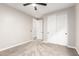 A light-filled bedroom with ample closet space and a ceiling fan for added comfort at 21408 S 224Th Pl, Queen Creek, AZ 85142