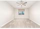 Bright bedroom with neutral carpet, ceiling fan and window with shade at 21408 S 224Th Pl, Queen Creek, AZ 85142