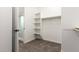Bright walk-in closet, conveniently located off the bathroom, offers plenty of storage space at 21408 S 224Th Pl, Queen Creek, AZ 85142