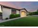 Exterior elevation showcasing landscaped yard and stucco siding at 21408 S 224Th Pl, Queen Creek, AZ 85142