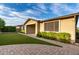 Beautiful single-story home featuring manicured landscaping and paver walkway leading to a covered entryway at 21408 S 224Th Pl, Queen Creek, AZ 85142