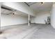 Large garage with high ceilings and concrete floor at 21408 S 224Th Pl, Queen Creek, AZ 85142