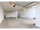 Spacious garage with concrete floors, lighting, and storage potential at 21408 S 224Th Pl, Queen Creek, AZ 85142