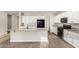 Modern kitchen featuring white cabinets, granite countertops, and stainless steel appliances at 21408 S 224Th Pl, Queen Creek, AZ 85142