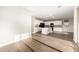 Open concept living space featuring a modern kitchen with stainless steel appliances and a spacious island at 21408 S 224Th Pl, Queen Creek, AZ 85142