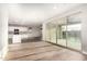 Bright, open living area seamlessly connecting kitchen, dining, and living spaces, with sliding doors to the patio at 21408 S 224Th Pl, Queen Creek, AZ 85142