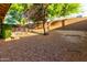 Spacious backyard with natural light and stone landscaping for outdoor enjoyment at 2315 W Beverly Rd, Phoenix, AZ 85041
