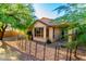 Charming backyard featuring drought-resistant landscaping, wrought iron fence and cozy patio with convenient access to the house at 2315 W Beverly Rd, Phoenix, AZ 85041