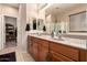 Bathroom showcasing a double sink vanity with ample counter space, a large mirror, and plenty of natural light at 2315 W Beverly Rd, Phoenix, AZ 85041
