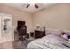 Neutral bedroom with wood floors, a workspace, and space for storage at 2315 W Beverly Rd, Phoenix, AZ 85041