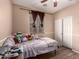 Cozy bedroom with wood floors, natural light, and a closet for optimal storage at 2315 W Beverly Rd, Phoenix, AZ 85041