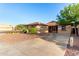 Charming single-story home with desert landscaping, a wide driveway, and a welcoming facade at 2315 W Beverly Rd, Phoenix, AZ 85041