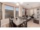 Living and dining area with an open floor plan that includes modern ceiling fan and ample windows at 2315 W Beverly Rd, Phoenix, AZ 85041