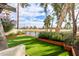 Lush backyard with artificial turf and views of the golf course at 2537 N Miller Rd, Scottsdale, AZ 85257