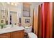 Well-lit half bathroom featuring a vanity sink and decorative elements at 26678 N Babbling Brook Dr, Phoenix, AZ 85083