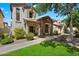 Charming two-story home with stone accents, landscaped front yard, and inviting walkway at 26678 N Babbling Brook Dr, Phoenix, AZ 85083
