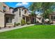 Beautiful two-story home featuring well-manicured lawn, stone details, and neutral color palette at 26678 N Babbling Brook Dr, Phoenix, AZ 85083