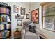 Cozy reading nook featuring a comfortable armchair, bookshelf and natural light at 26678 N Babbling Brook Dr, Phoenix, AZ 85083