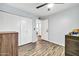 This is a bedroom featuring wood flooring and a large closet with bi-fold doors at 2924 W Anderson Dr, Phoenix, AZ 85053