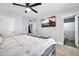 Comfortable bedroom with a ceiling fan and a mounted TV at 2924 W Anderson Dr, Phoenix, AZ 85053