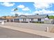 Single-story home with a gray roof, light exterior, and low-maintenance landscaping at 2924 W Anderson Dr, Phoenix, AZ 85053