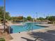 A resort-style community pool with shaded areas, lounge chairs, and lush landscaping for ultimate relaxation at 310 S San Christo Ln, Casa Grande, AZ 85194