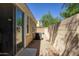 Enclosed backyard patio with gravel, providing a private outdoor space at 3450 E Milky Way, Gilbert, AZ 85295