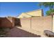 Enclosed backyard area with gravel landscaping and an access gate to the rest of the property at 3450 E Milky Way, Gilbert, AZ 85295