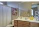 Bathroom with vanity, mirror and neutral-toned shower curtain, offering a clean and functional space at 3450 E Milky Way, Gilbert, AZ 85295