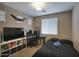 Comfortable bedroom with dark bedding, large television, and a functional workspace at 3450 E Milky Way, Gilbert, AZ 85295