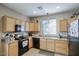 Functional kitchen with black appliances, plenty of counter space, and ample cabinet storage at 3450 E Milky Way, Gilbert, AZ 85295