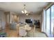 Open-concept living room with dining area and comfortable gray sofa, perfect for entertaining at 3450 E Milky Way, Gilbert, AZ 85295