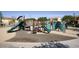 Community playground with slides, climbing structure, and padded flooring for safety at 3450 E Milky Way, Gilbert, AZ 85295