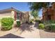 Landscaped side yard with a brick pathway and low-water plants, creating an inviting outdoor space at 3450 E Milky Way, Gilbert, AZ 85295