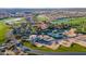 Stunning aerial view showcases the community's manicured landscaping, golf course, tennis courts, and beautiful homes at 36145 N Desert Tea Dr, Queen Creek, AZ 85140