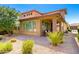 The home has a spacious backyard with patio, desert landscaping, and privacy, ideal for outdoor entertaining at 36145 N Desert Tea Dr, Queen Creek, AZ 85140