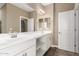 Bright bathroom with double sink vanity, a large mirror and lots of storage space at 36145 N Desert Tea Dr, Queen Creek, AZ 85140
