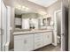 Bathroom features a double vanity with granite countertops, ample storage, and a separate shower at 36145 N Desert Tea Dr, Queen Creek, AZ 85140