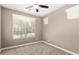 Neutral-toned bedroom features multiple windows and a ceiling fan at 36145 N Desert Tea Dr, Queen Creek, AZ 85140