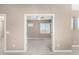 Spacious bedroom with neutral color palette and views through the doorway to another room at 36145 N Desert Tea Dr, Queen Creek, AZ 85140