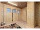 Spacious bonus room showcasing unfinished walls, natural light and endless possibilities at 36145 N Desert Tea Dr, Queen Creek, AZ 85140