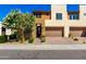 Charming two-story home with desert landscaping, a two-car garage, and a welcoming front entrance at 36145 N Desert Tea Dr, Queen Creek, AZ 85140