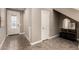 Inviting foyer with tiled floors, a decorative glass front door, and stylish decor on a console table at 36145 N Desert Tea Dr, Queen Creek, AZ 85140