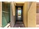 Close-up of the front door with glass inserts and adjacent window allowing natural light into the entryway at 36145 N Desert Tea Dr, Queen Creek, AZ 85140