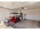 Spacious garage with high ceiling and golf cart with lots of space for additional storage at 36145 N Desert Tea Dr, Queen Creek, AZ 85140